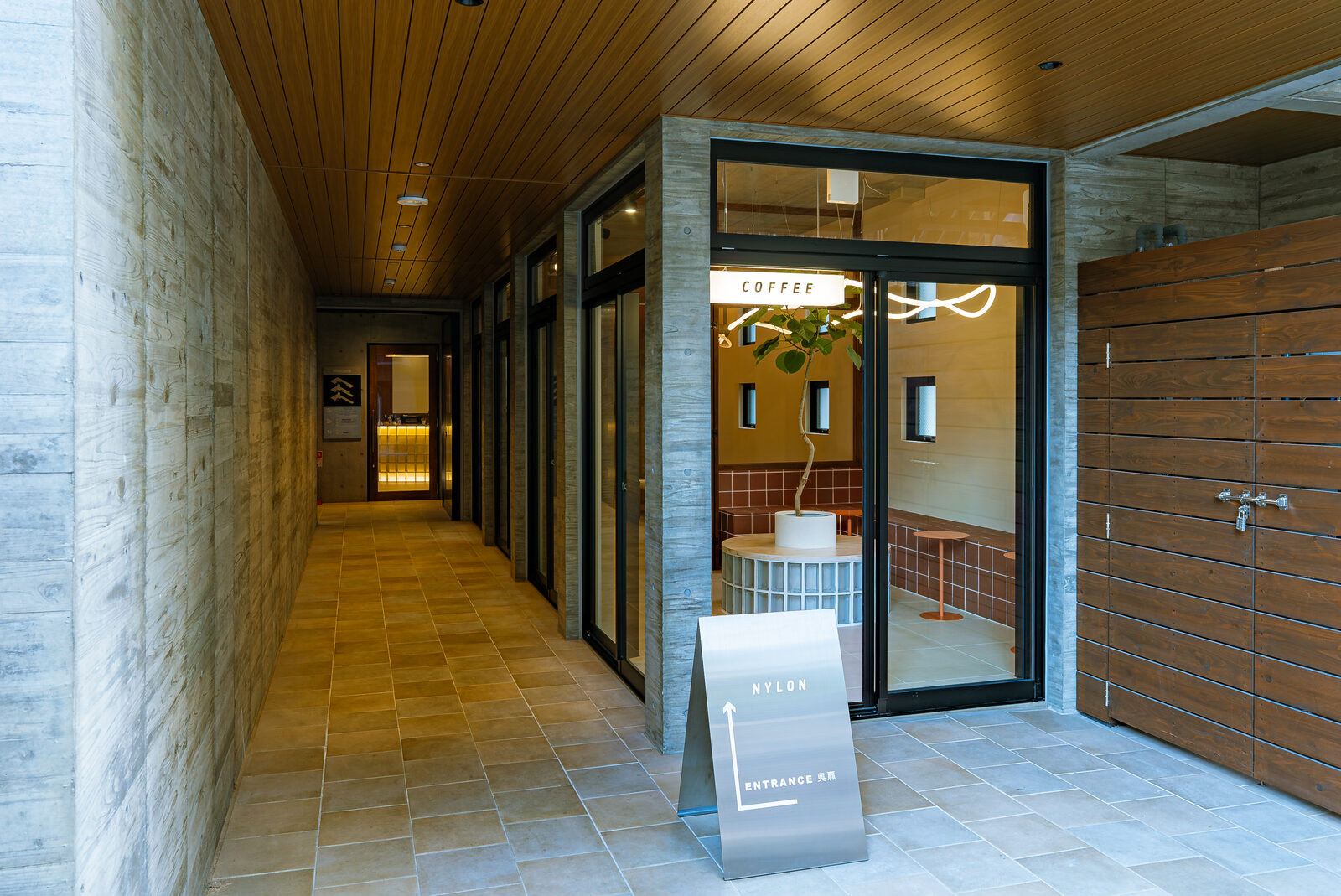 The approach from the street, drawing the eye toward the entrance