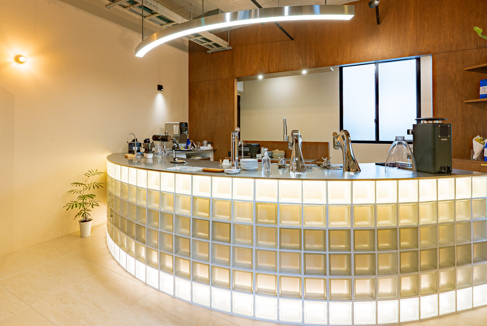 A rounded counter built from backlit glass block