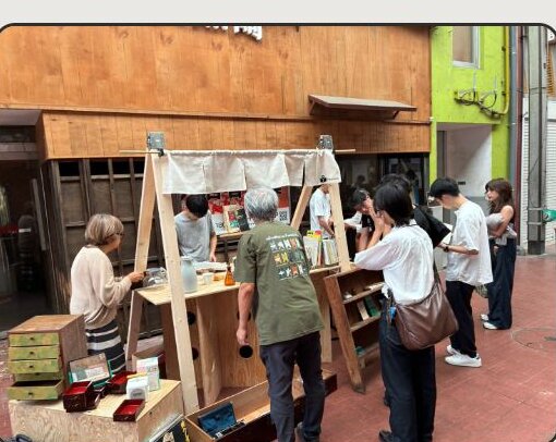 The vendor booth in use at a flea market in Kurosaki, Kitakyushu, selling used books and sundries